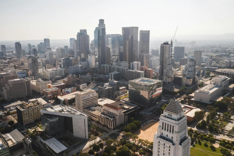 an aerial view of a city with tall buildings, inspired by L. A. Ring, unsplash contest winner, hyperrealism, dezeen, schools, downtown, taken in the early 2020s