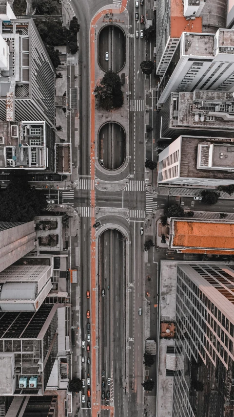 a city street filled with lots of tall buildings, by Adam Rex, unsplash contest winner, overpass, drone photograpghy, square, deeply hyperdetailed