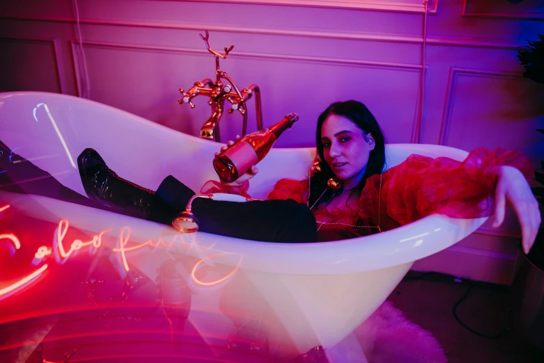 a woman laying in a bathtub with a neon sign, an album cover, by Julia Pishtar, pexels contest winner, drinking champagne, oona chaplin, magenta lighting. fantasy, close full body shot