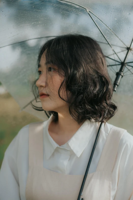 a woman in a white shirt holding an umbrella, inspired by Kim Jeong-hui, unsplash, short wavy hair, profile image, translucent, 奈良美智