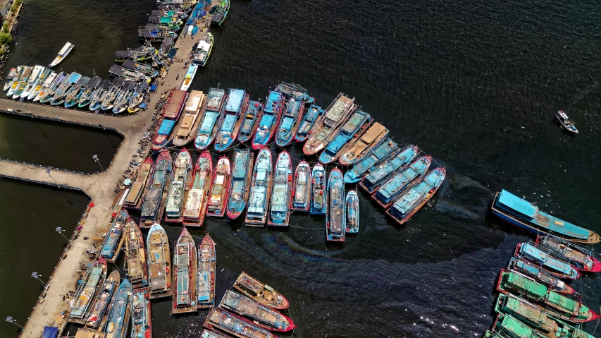 a group of boats sitting on top of a body of water, a digital rendering, pexels contest winner, hurufiyya, shipping docks, egypt, national geographic photo award, multicoloured