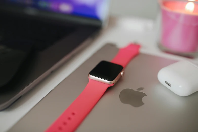 an apple watch sitting on top of a desk next to a laptop, pexels, hot pink, square, various posed, close up details