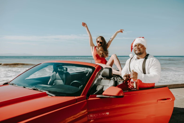 a man and woman sitting on top of a red car, holiday vibe, dr zeus, jack black, santa