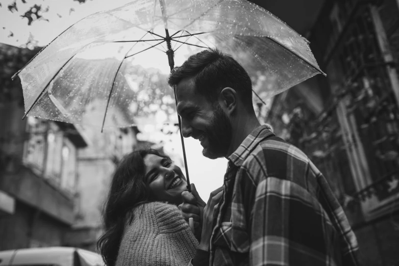 a black and white photo of a couple under an umbrella, pexels contest winner, smiling playfully, 15081959 21121991 01012000 4k, portrait of a smiling, happy cozy feelings