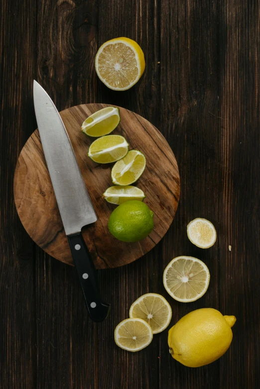 a cutting board with lemons and a knife on it, pexels contest winner, renaissance, lime, multiple stories, soup, looking threatening