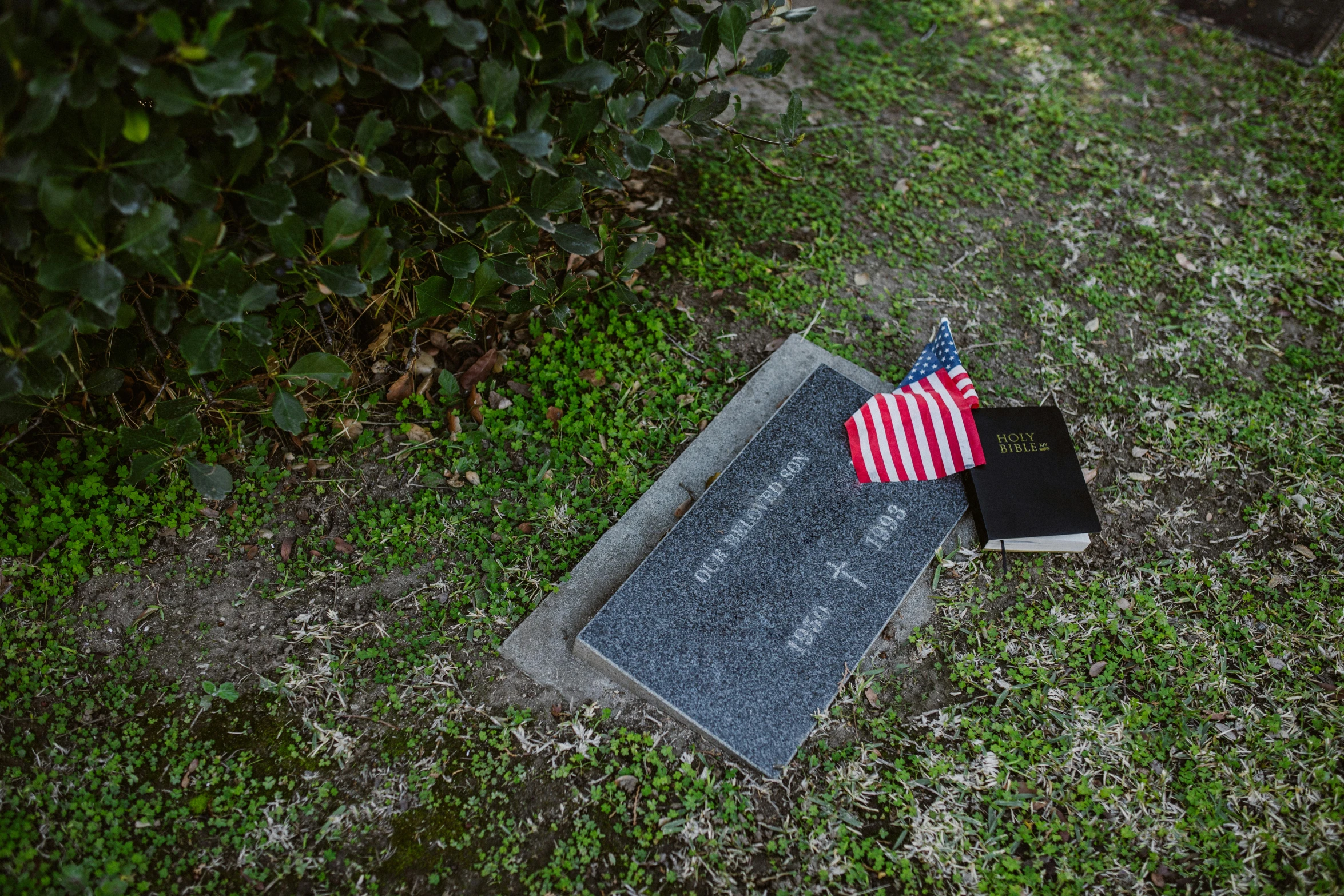 an american flag laying on top of a grave, a portrait, by Carey Morris, top - down photograph, fan favorite, in louisiana, album