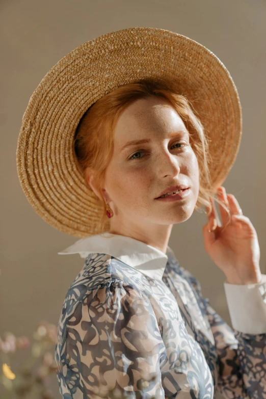 a woman in a blue dress and a straw hat, a portrait, inspired by Aimé Barraud, trending on pexels, renaissance, ( redhead, wearing a linen shirt, delicate patterned, promotional image