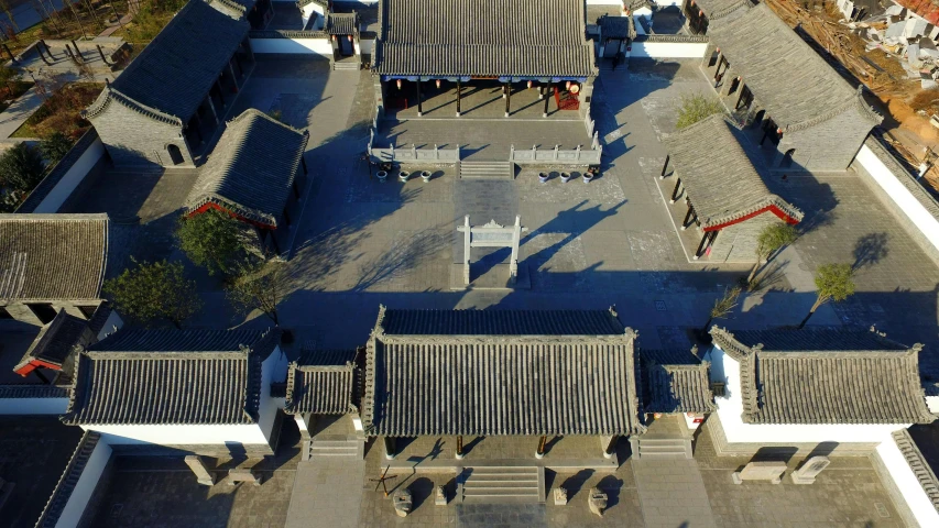 an aerial view of a courtyard in a chinese village, inspired by Xuande Emperor, pexels contest winner, mingei, white, square, high shadow, [ cinematic