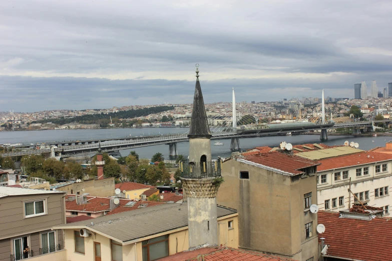 a view of a city with a bridge in the background, hurufiyya, spire, landscape photo