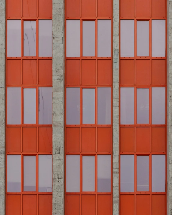 a red fire hydrant sitting in front of a tall building, a digital rendering, inspired by Andreas Gursky, pexels contest winner, brutalism, house windows, grey orange, triptych, vertical symmetry