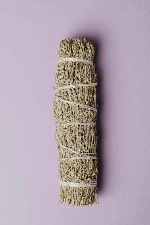 a bundle of white sage smudges on a purple background, really long, savanna, ignant, smooth matte