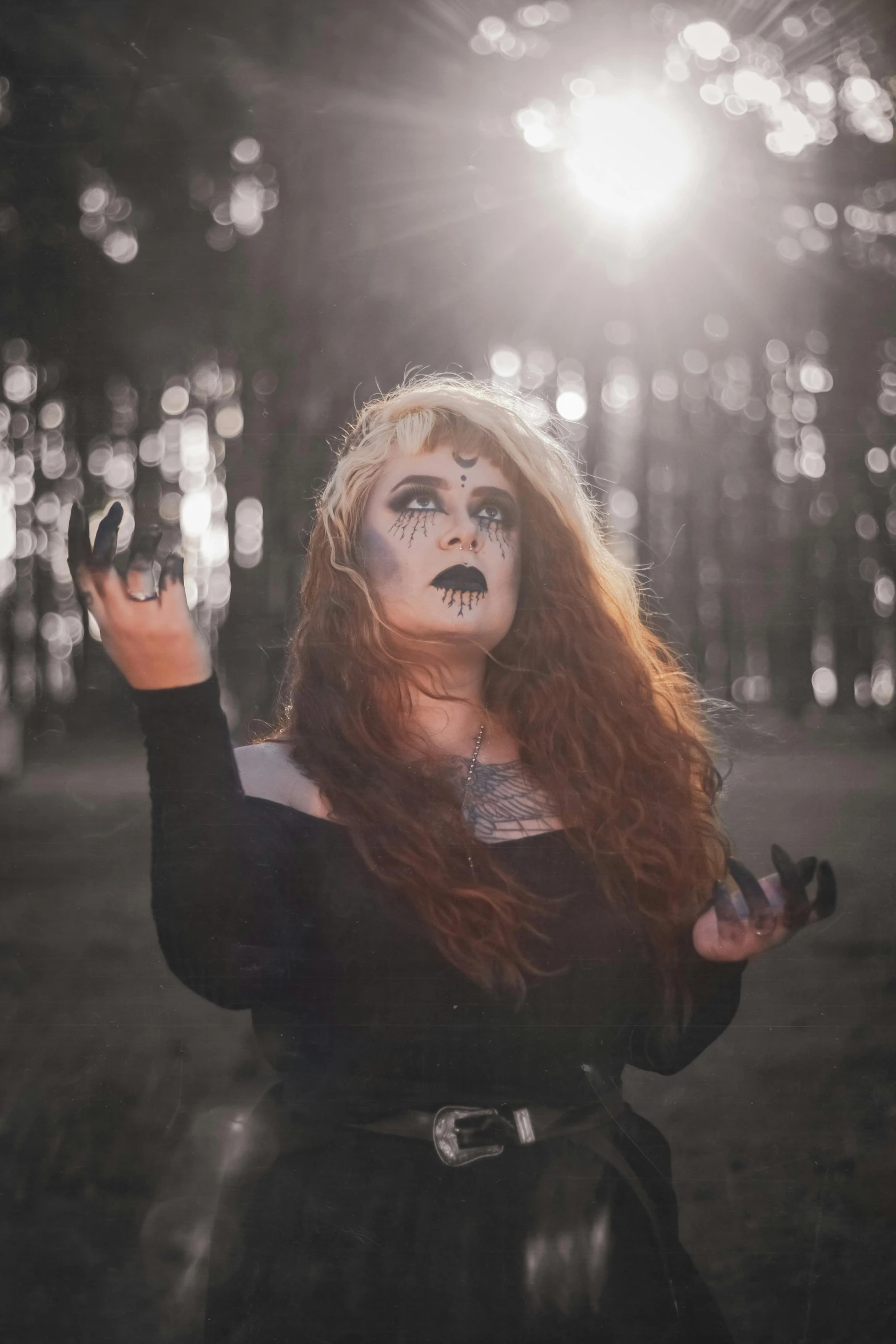 a woman standing in the middle of a forest, inspired by Kati Horna, pexels contest winner, gothic art, drag queen, looking threatening, maiden with copper hair, black sclera