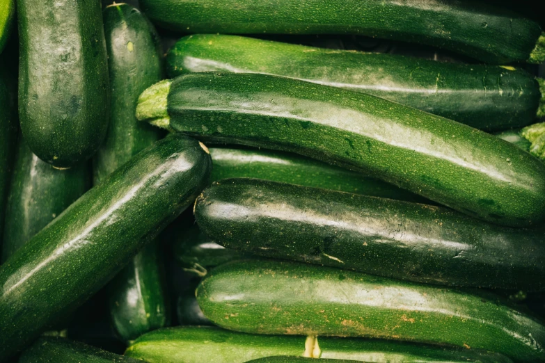 a pile of cucumbers sitting on top of each other, unsplash, renaissance, 🦩🪐🐞👩🏻🦳, green flags, oscar winning, made of glazed