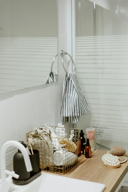 a bath room with a sink a mirror and a shower, by Miyamoto, unsplash, soft light through blinds, jar on a shelf, silver accessories, on clear background