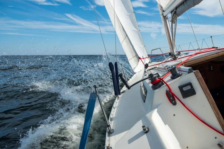 a sailboat sailing in the ocean on a sunny day, a picture, by Jan Tengnagel, happening, helmet is off, splashing, on the bow, high quality picture