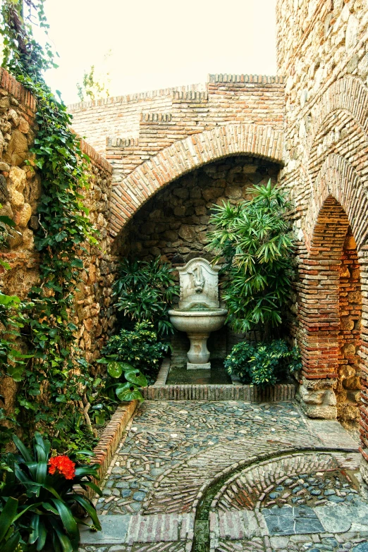 a courtyard with a fountain in the middle of it, a statue, inspired by Luis Paret y Alcazar, high walled tunnel, vine covered, watering can, brick