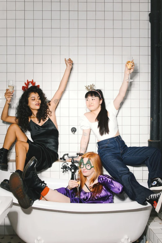 a group of women sitting in a bath tub, inspired by Nan Goldin, trending on pexels, feminist art, wearing a party hat, the scooter ( edm band, asian descent, sitting at a bar