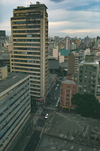a view of a city from a high rise building, by Felipe Seade, street corner, full frame image, edu souza, 4k image