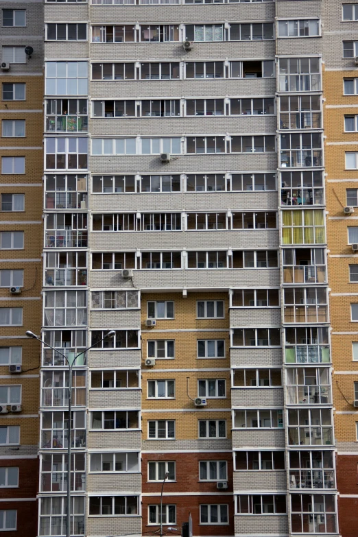 a very tall building with a bunch of windows, an album cover, unsplash, socialist realism, soviet suburbs, 15081959 21121991 01012000 4k, panorama, balconies