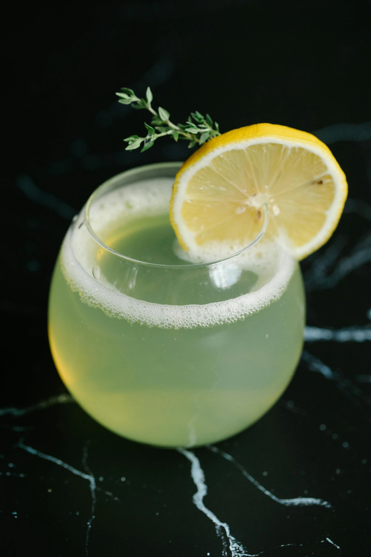 a glass of lemonade with a slice of lemon, inspired by Géza Dósa, pale green glow, buzzed sides, ivy, mead
