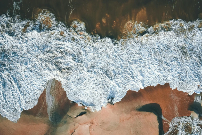 an aerial view of a large body of water, pexels contest winner, analytical art, “ iron bark, sea foam, thumbnail, red sand