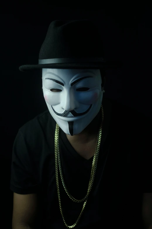 a man wearing a mask with a pipe in his mouth, an album cover, by artist, pexels, dark hat, hacker, revolutionary, masqua