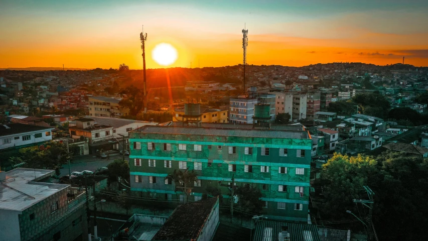 an aerial view of a city at sunset, an album cover, pexels contest winner, quito school, orange and teal color, madagascar, sun set, bangladesh