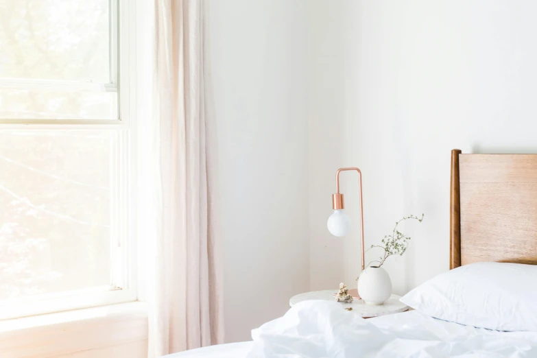 a white bed sitting in a bedroom next to a window, by Nicolette Macnamara, unsplash contest winner, light and space, copper details, curtains, pink, plain white background