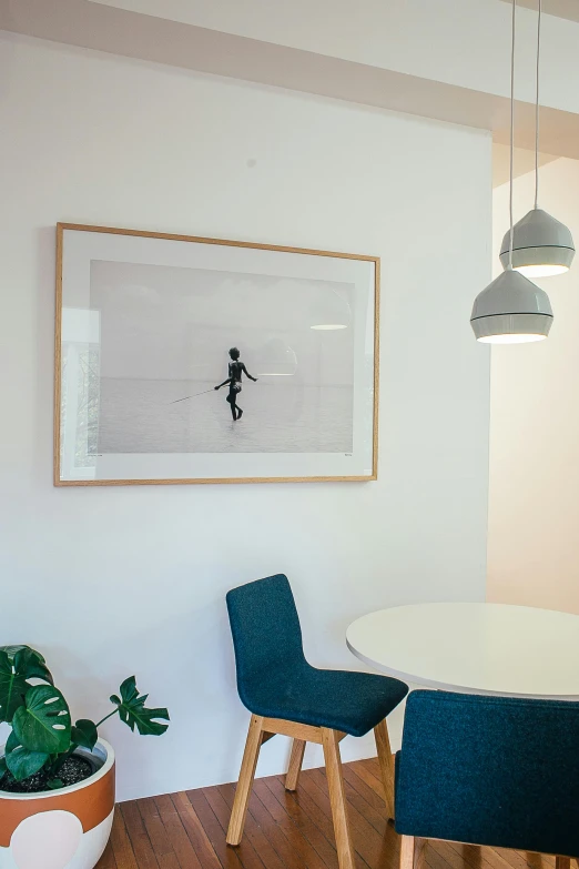 a dining room with a white table and blue chairs, poster art, by Gavin Hamilton, unsplash contest winner, light and space, in office, recessed, in detail, our art corner