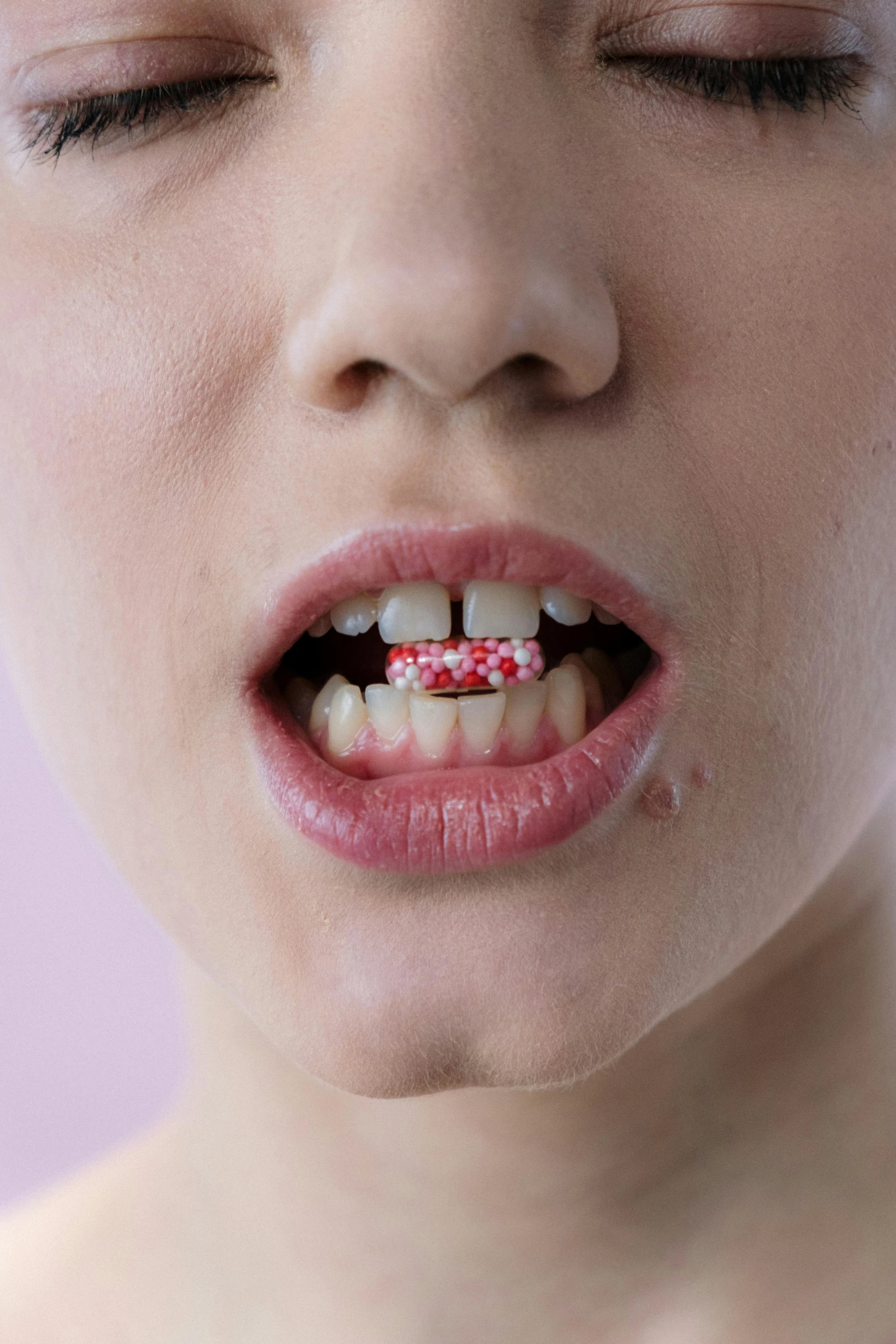 a close up of a person with a tooth brush, inspired by Damien Hirst, antipodeans, blood around the lips, nonbinary model, “diamonds, candy - coated