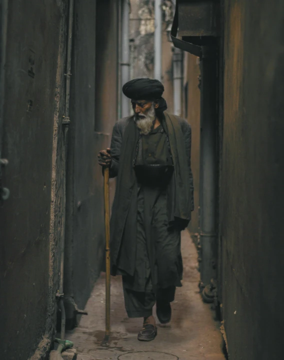 an old man walking down a narrow alleyway, unsplash contest winner, qajar art, ( ( theatrical ) ), grey skinned, old and young, modest