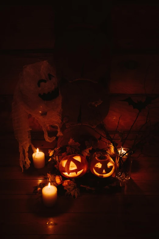 a group of pumpkins sitting on top of a wooden table, in the dark, displayed on an altar, profile image, costume