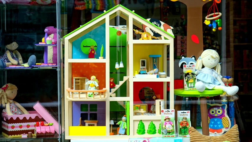 a doll house in the window of a toy store, a cartoon, by Helen Berman, pixabay, toyism, fisher price redwood forest, multicoloured, wide high angle view, activity play centre