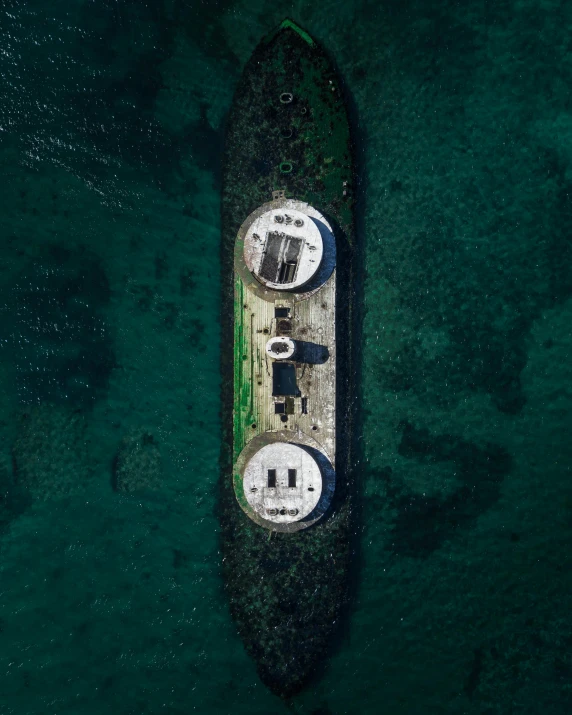 an aerial view of a ship in the water, by Filip Hodas, unsplash contest winner, bunkers, pre - ww 1 submarine, reykjavik, thumbnail
