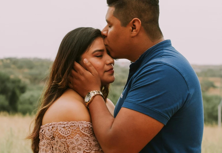 a man and woman standing next to each other in a field, pexels contest winner, hispanic, thick lips, embraced, avatar image