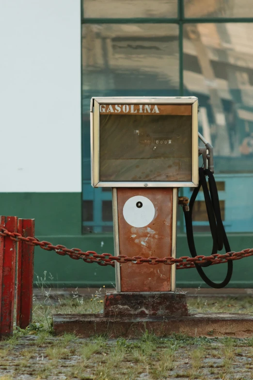 a gas pump sitting on the side of a road, an album cover, inspired by Elsa Bleda, pexels contest winner, graffiti, brown, chile, gasoline engine, square