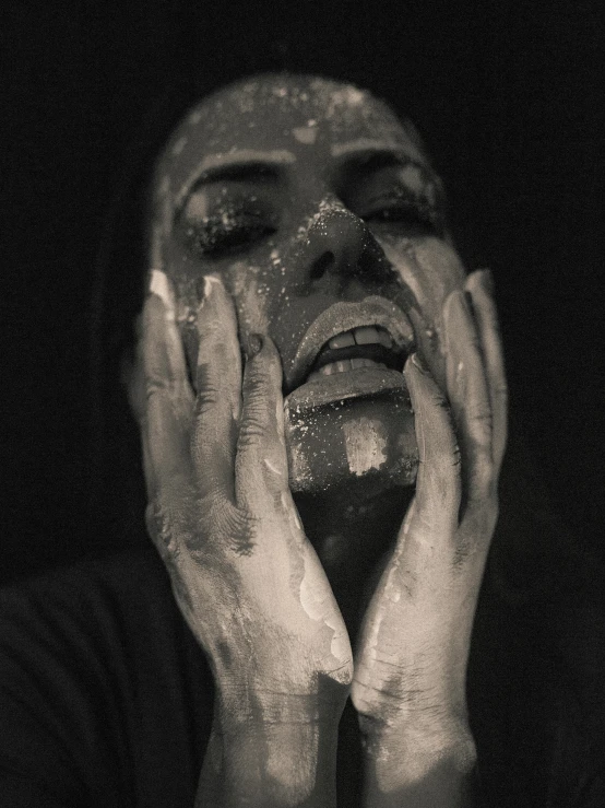 a black and white photo of a man with his hands on his face, inspired by Nicola Samori, covered in salt, woman crying rainbow paint, photograph taken in 2 0 2 0, black metal aesthetics