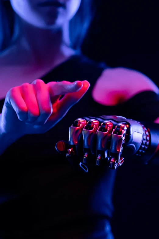 a close up of a person holding a glove, a digital rendering, unsplash, holography, robotic prosthetic limbs, cinematic red lighting, a cyborg meditating, instagram post