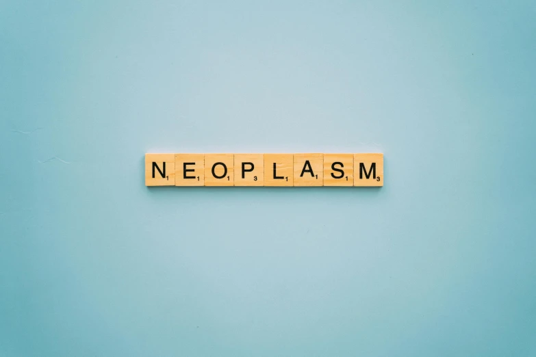 the word neoplasm spelled in scrabbles on a blue background, an album cover, trending on unsplash, neoplasticism, opal flesh, plain background, serial experiments lain, flawless epidermis