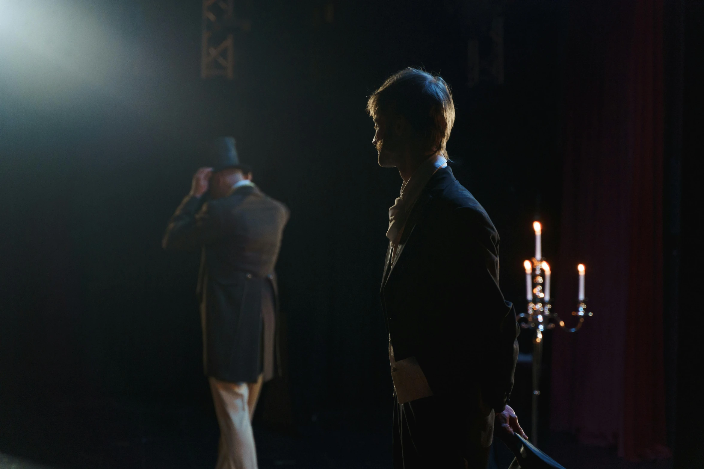 a couple of men standing next to each other on a stage, by Alice Mason, unsplash, romanticism, gaslight, set photo in costume, 8 k movie still, obscured underexposed view