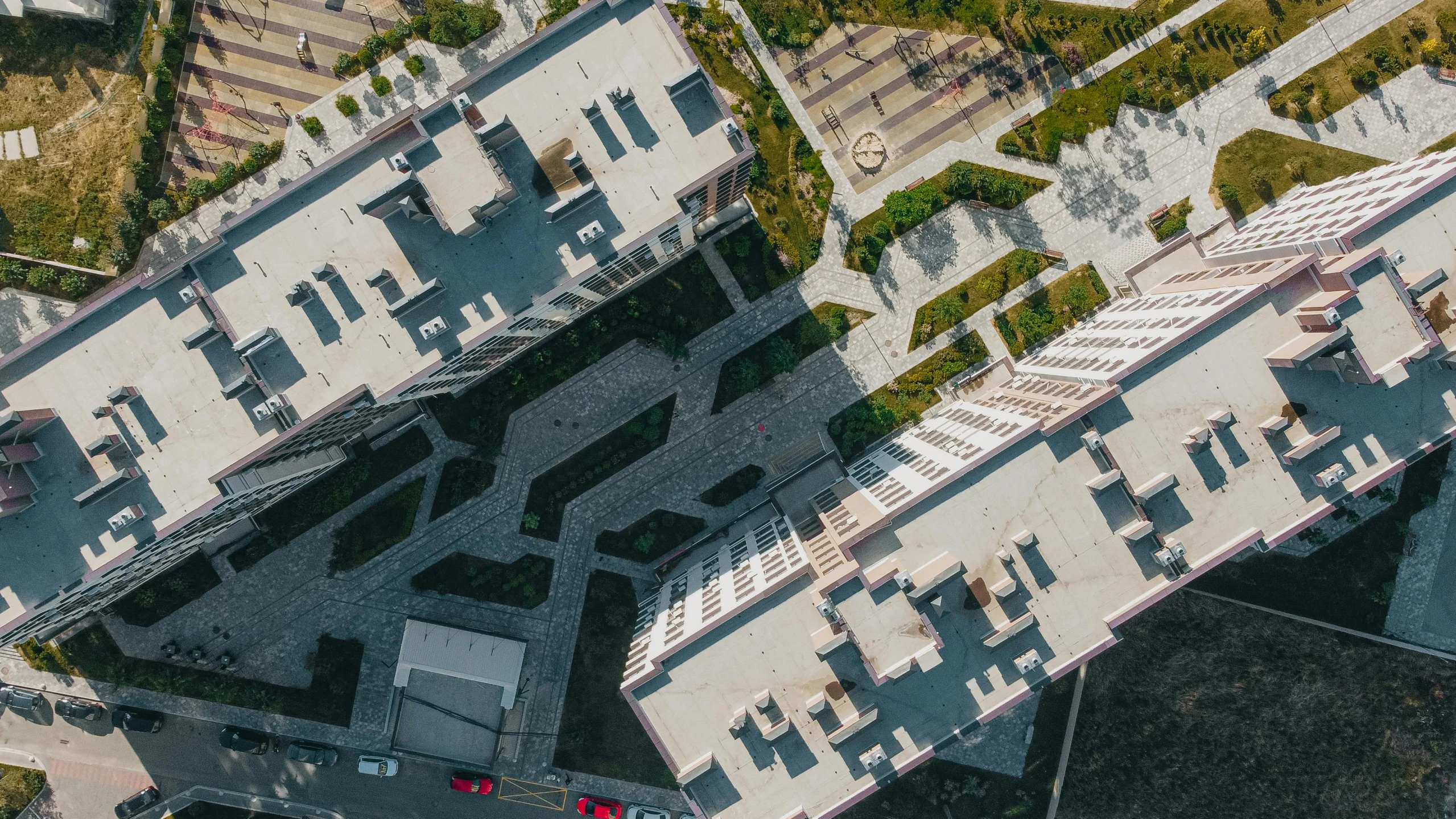 an aerial view of the top of a building, a digital rendering, by Adam Marczyński, unsplash contest winner, residential area, high angle close up shot, dynamic angled shot, university