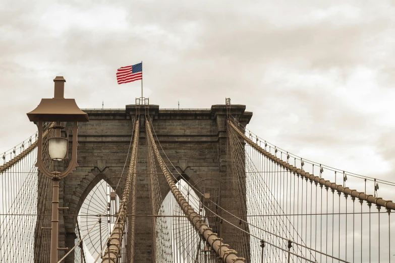 an american flag flying on top of the brooklyn bridge, inspired by Thomas Struth, pexels contest winner, jen atkin, slide show, profile image, high quality print