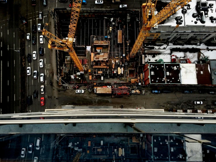 a view of a city from the top of a building, an album cover, inspired by Thomas Struth, unsplash contest winner, constructivism, cars parked underneath, under construction, seattle, high angle uhd 8 k