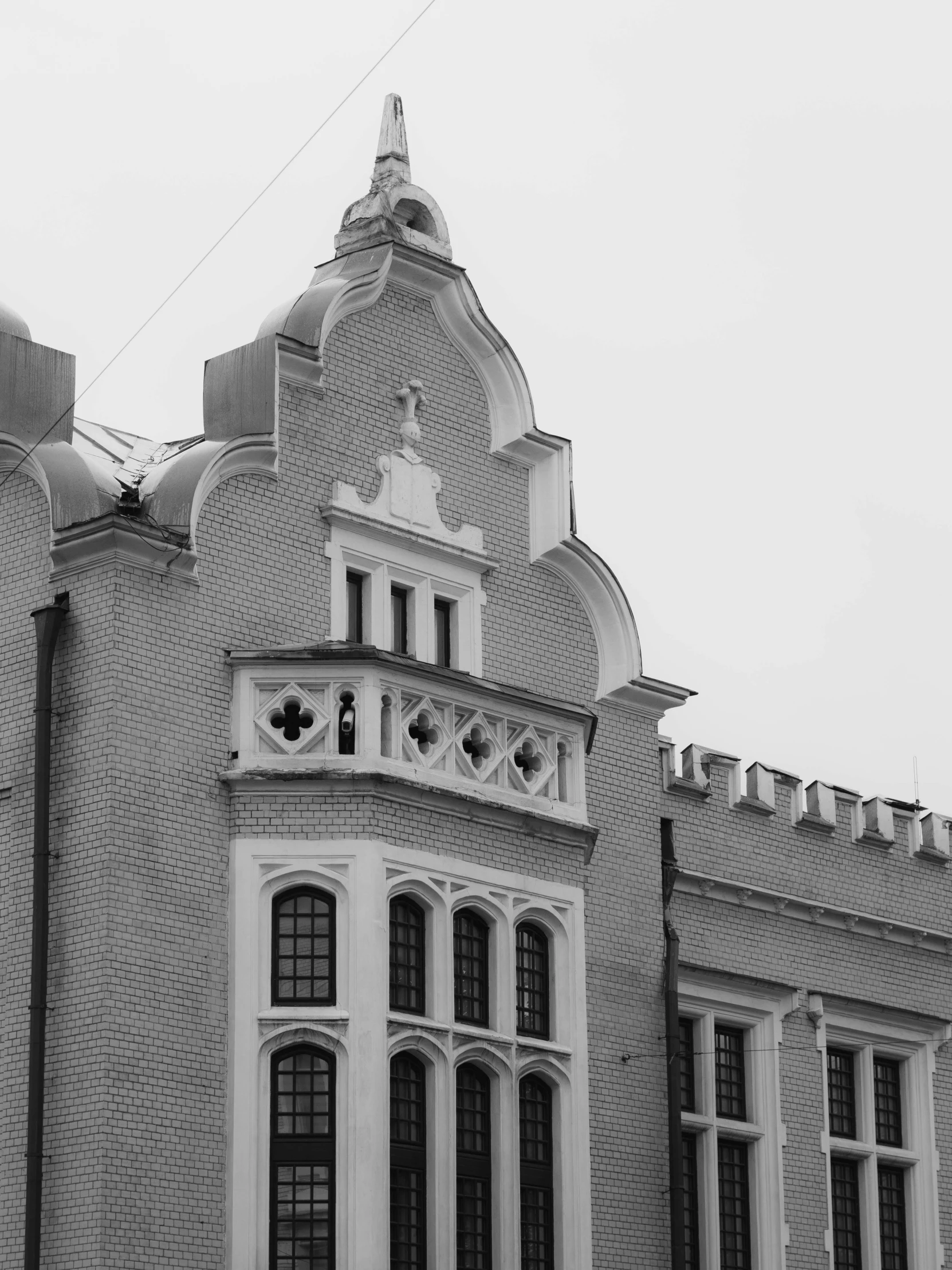 a black and white photo of a large building, a black and white photo, by Lorraine Fox, unsplash, art nouveau, kalighat, maxim sukharev, tri - x pan stock, brick building