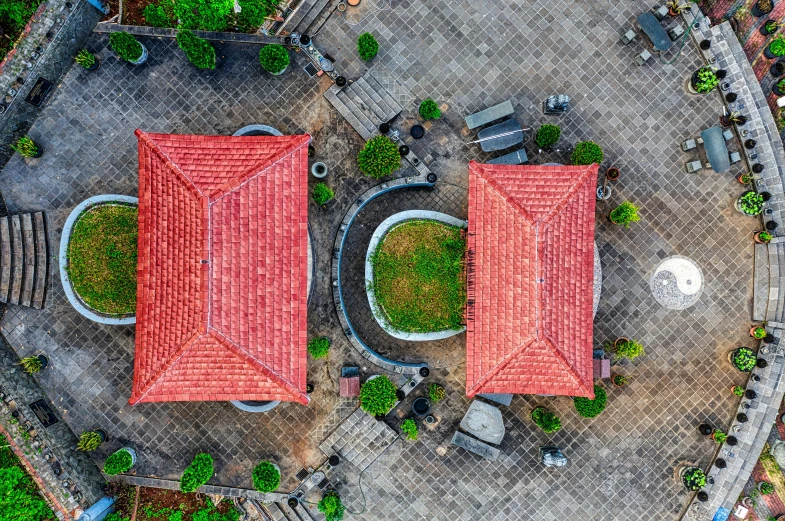 a bird's eye view of two red roofed buildings, an album cover, by Daniel Lieske, pexels contest winner, indonesia, school courtyard, tiled roofs, parks and monuments