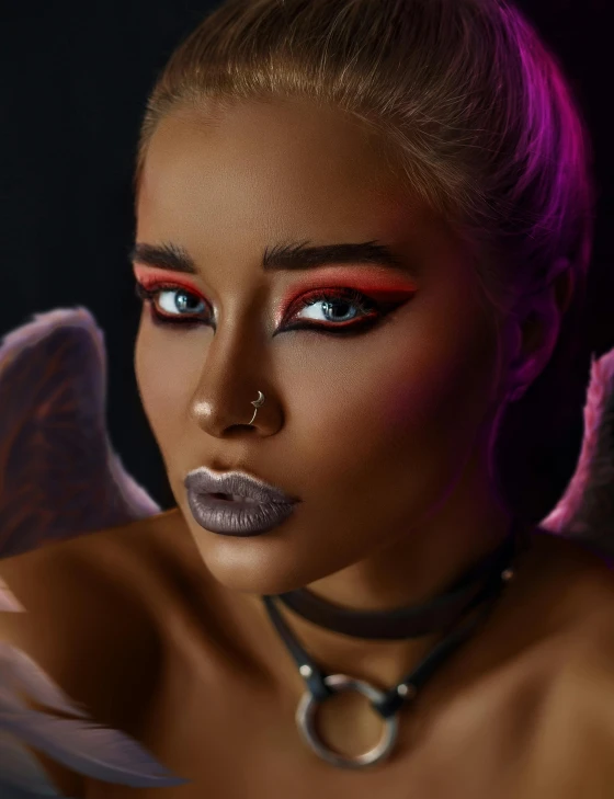 a close up of a woman with wings on her head, a screenshot, inspired by Hedi Xandt, trending on pexels, afrofuturism, dark eyeshadow, ariana grande as a sith, beautiful female vampire, non binary model