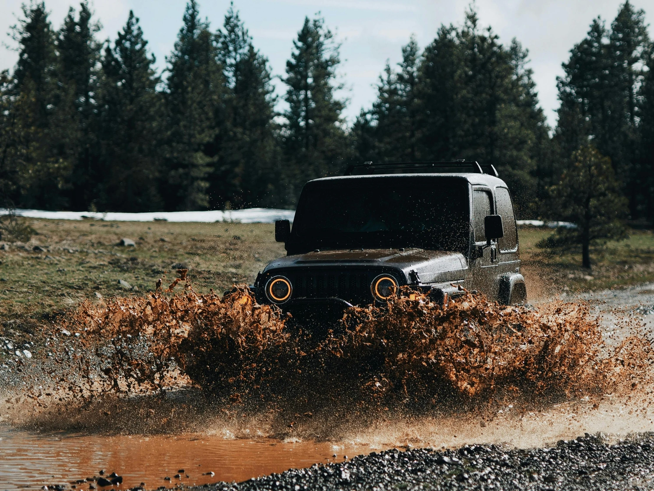 a jeep driving through a puddle of water, by Daniel Seghers, unsplash contest winner, auto-destructive art, pulling the move'derp banshee ', 2 0 0 0's photo, casey cooke, **cinematic