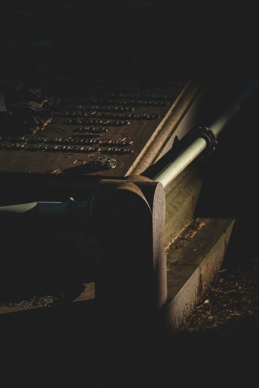 a baseball bat sitting on top of a wooden bench, an album cover, unsplash, australian tonalism, sitting in a cemetery at night, extreme intricate metal details, tomb, brown