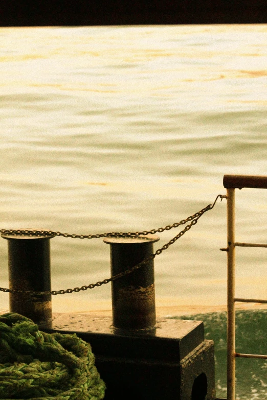 a view of a body of water from a boat, a picture, inspired by Elsa Bleda, unsplash, romanticism, ((chains)), 1960s color photograph, railing, guwahati