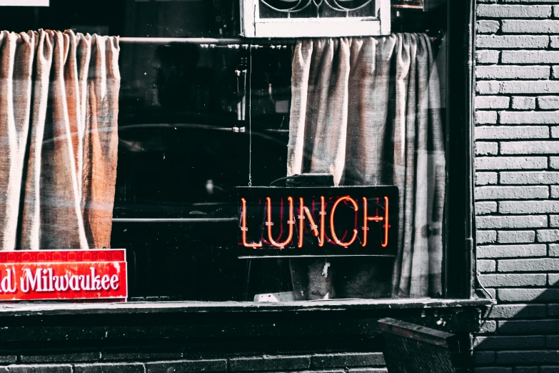 a black and white photo of a window with a lunch sign, trending on unsplash, red neon light, brown, long, lynchian